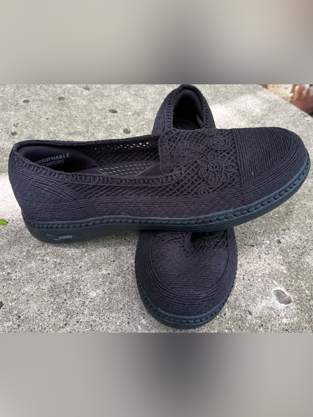 Skechers Women's Venice Arch Fit Crochet Slip-On Loafers in black.
